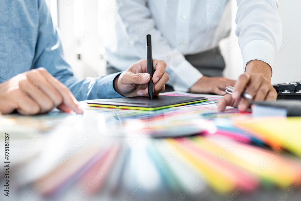 Poster two creative graphic designer team working on color selection and drawing on graphic tablet, color s