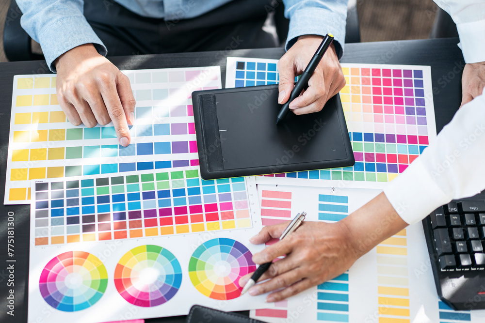 Poster Team of creative graphic designer working on color swatch samples chart for selection coloring in inspiration to create new collection at workplace