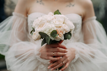 The image features a person holding a bouquet of white flowers 6847.