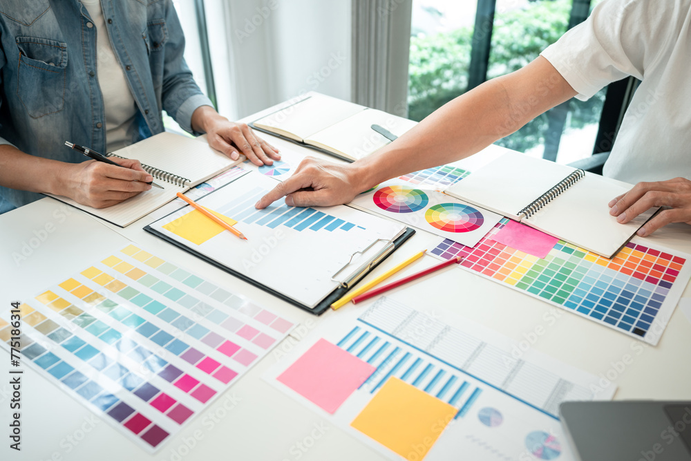 Poster Team of creative graphic designer working on color swatch samples chart for selection coloring in inspiration to create new collection at workplace