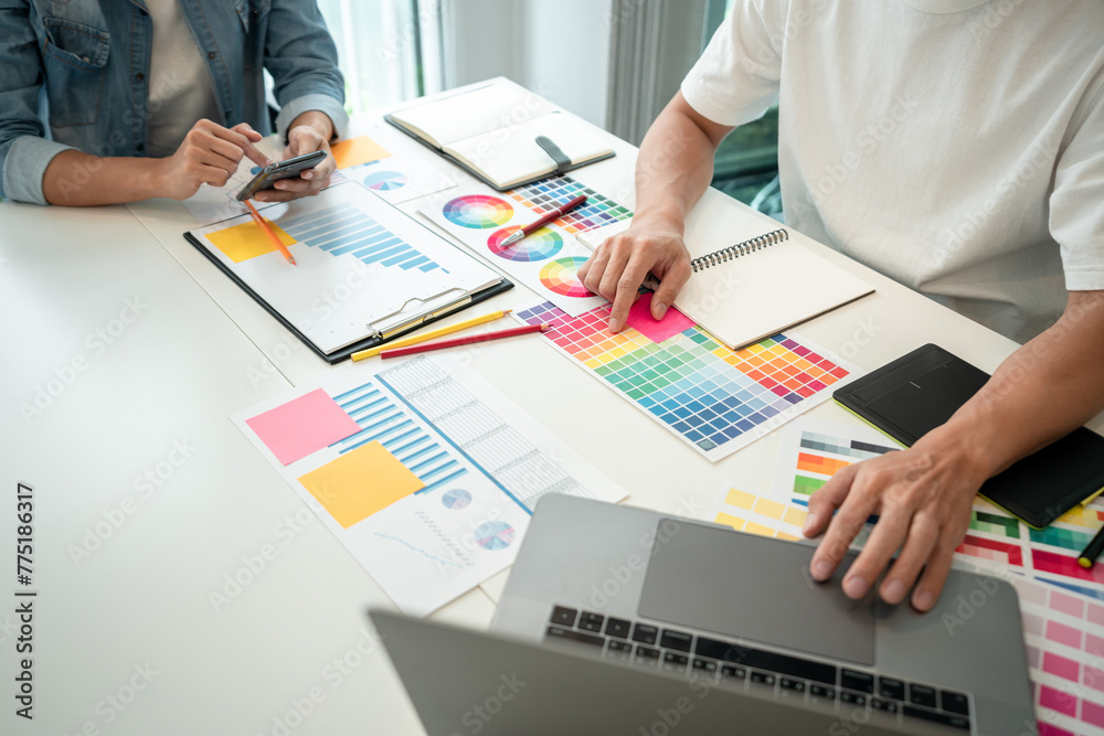 Aufkleber two creative graphic designer team working on color selection and drawing on graphic tablet, color s