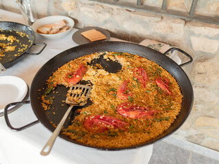 Large Paella Pan with Delicious Meal at Outdoor Gathering