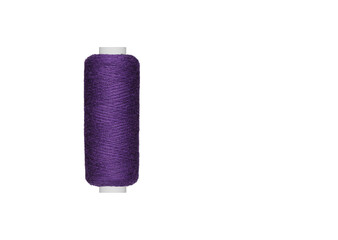 purple spool of sewing thread isolated on white background close up