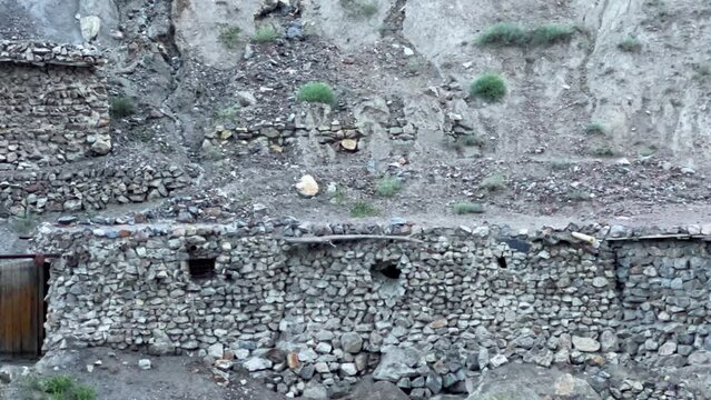 Old villages in Tajikistan. Tajikistan's road along the Zeravshan River near the Pamir highway. Old stone villages in the mountains of the Silk Road. 4К