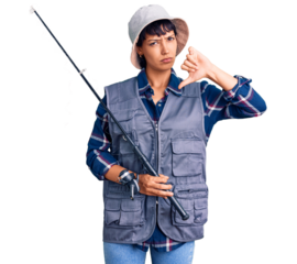 Young brunette woman with short hair wearing fisherman equipment with angry face, negative sign showing dislike with thumbs down, rejection concept