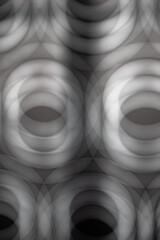 Abstract image in gray tones of multiple blurred circles creating the sensation of depth. Wallpaper, patterns, backgrounds.