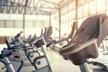 Sport gym trainning background, focus on bicycle machine equipment of training sport.
