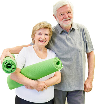 Gl&uuml;ckliches sportliches Senioren Paar mit Yogamatte
