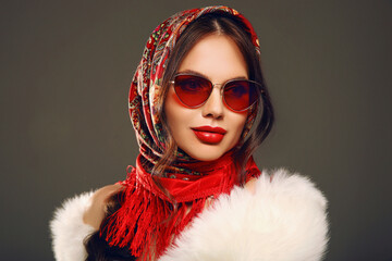 Russian girl Matryoshka Fashion style. Young woman portrait with sunglasses and traditional red...