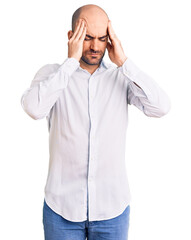 Young handsome man wearing elegant shirt suffering from headache desperate and stressed because pain and migraine. hands on head.