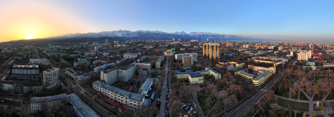 View from a quadcopter of the central part of the largest city of Kazakhstan - Almaty in the early...