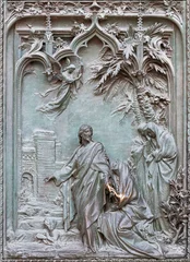 Tuinposter MILAN, ITALY - SEPTEMBER 16, 2024: The detail from main bronze gate of the Cathedral - Annunciation -  by Ludovico Pogliaghi (1906). © Renáta Sedmáková
