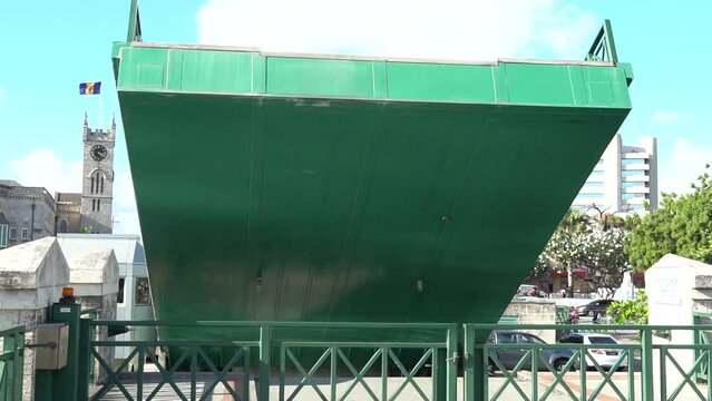 Bridgetown, Barbados 03 15 2024: Green movable drawbridge captured while lifting in Bridgetown on the Caribbean island of Barbados.