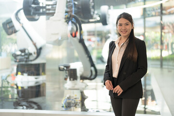 Confident businesswoman with robotics technology - 775232151