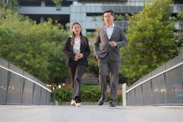 Business professionals walking in modern urban setting
