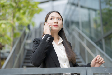 Businesswoman talking on phone outdoors