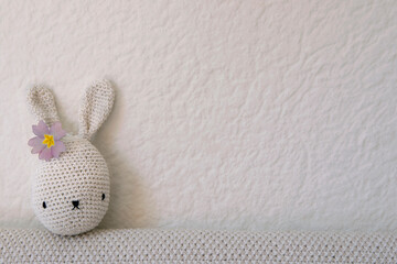 DIY amigurumi crotchet bunny toy. Baby, newborn, infant background.