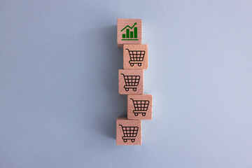 Sale volume increase make business grow, Flips cube with icon graph and shopping cart symbol.