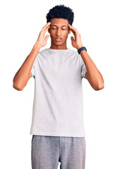 Young african american man wearing casual clothes with hand on head for pain in head because stress. suffering migraine.