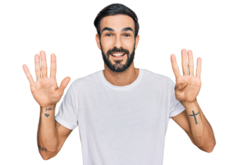 Young hispanic man wearing casual white t shirt showing and pointing up with fingers number nine while smiling confident and happy.