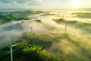 Aerial View of Wind Turbines Amongst Misty Rolling Hills at Sunrise