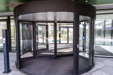 Modern entrance with revolving door. Entrance to a building.