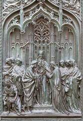MILAN, ITALY - SEPTEMBER 16, 2024: The detail from main bronze gate of the Cathedral - Spouse of St. Joseph and Virgin Mary -  by Ludovico Pogliaghi (1906). - 775242349