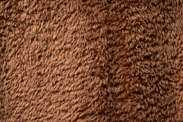 Texture of a brown faux fur as a background.