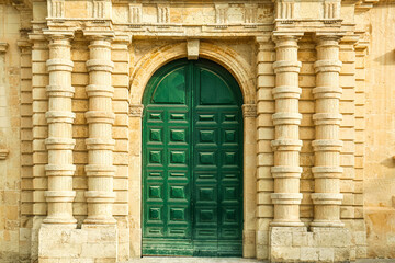 View of old building with wooden door