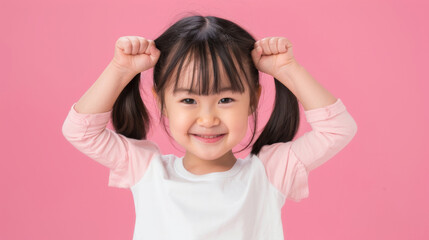 A young girl is smiling and flexing her arms muscle, healthy and happy kid concept.