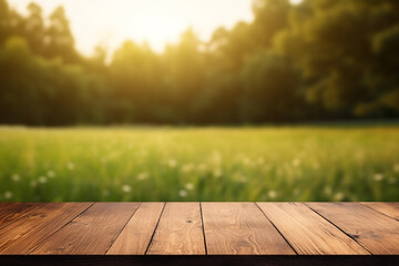 Empty wooden planks or tabletop in front of a blurred bokeh lush grass nature environment and minimalist background a product display background or wallpaper concept with backlighting 