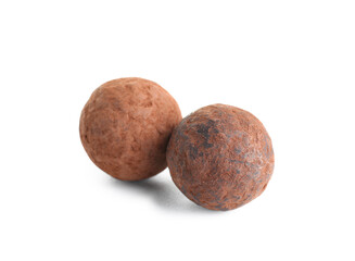 Tasty chocolate truffles on white background