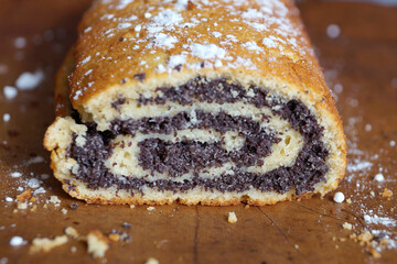 poppy seed roll sprinkled with powdered sugar