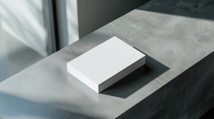 A white box sitting on top of a table. Perfect for product display