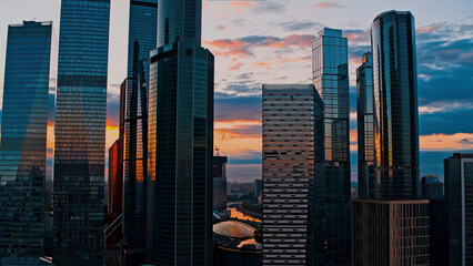 High buildings of Moscow-City at Moskva River at summer sunset, Russia. Moscow-City is business district in Moscow. Panorama of modern office buildings at summer sumset, Moscow downtown in summer