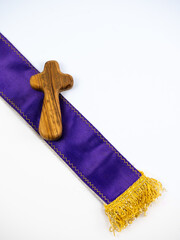 Purple violet priests stole with a cross, white background