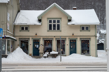 A shop on a Snowy Winter Street in Rjukan with Nordic Architecture