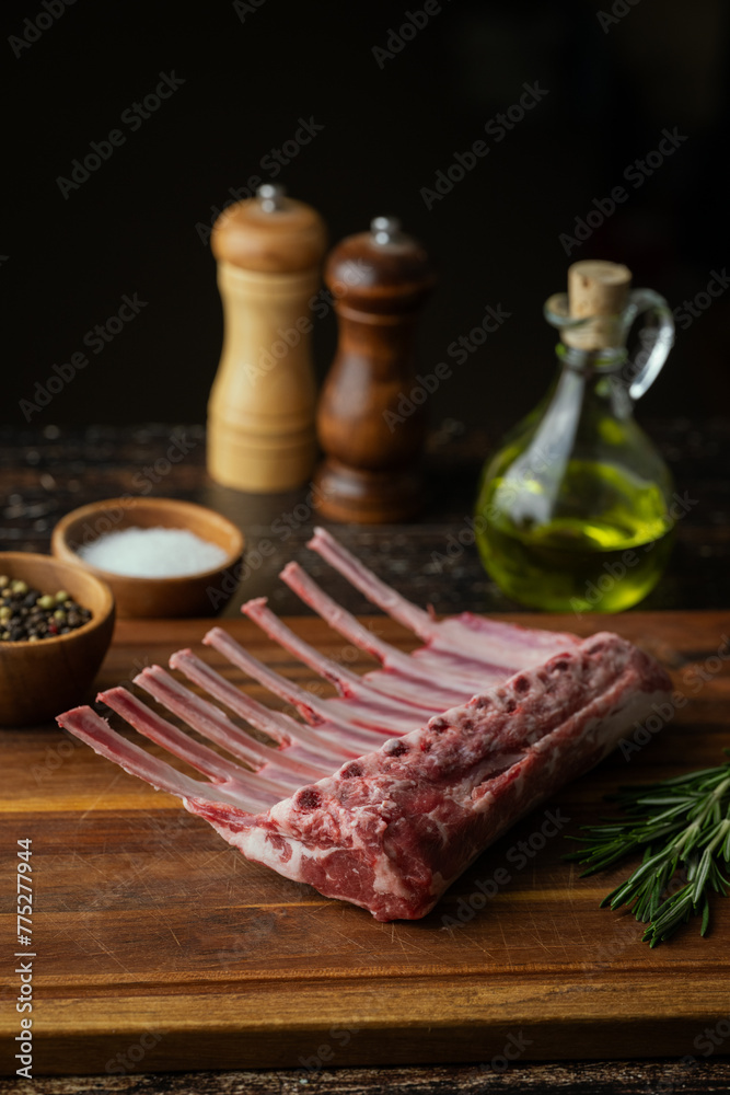 Sticker fresh lamb chop on wooden cutting board