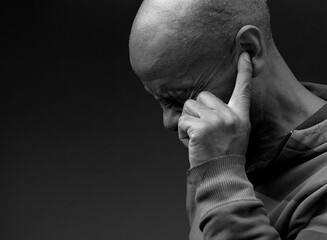 deaf man suffering from deafness and hearing loss on gray background with people stock image stock...