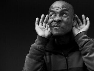 deaf man suffering from deafness and hearing loss on gray background with people stock image stock...