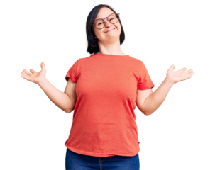 Brunette woman with down syndrome wearing casual clothes and glasses celebrating mad and crazy for success with arms raised and closed eyes screaming excited. winner concept