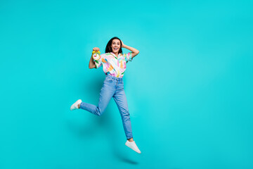 Photo of cheerful crazy latin woman dressed stylish clothes hold clock sale time isolated on cyan...