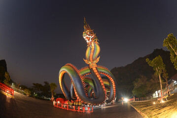 Night scene of Naga body is called Grandpa Phaya Sri Phet Khiri Mahamuni Srisutthonakarat Enshrined at Tham Chaeng Temple, it is a large and colorful Naga figure. It has become a new landmark tourist 