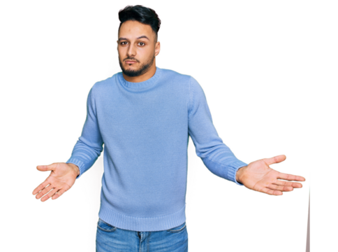 Young arab man wearing casual clothes clueless and confused expression with arms and hands raised. doubt concept.