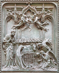 MILAN, ITALY - SEPTEMBER 16, 2024: The detail from main bronze gate of the Cathedral -   Nativity -  by Ludovico Pogliaghi (1906).