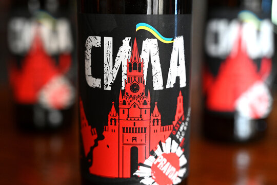 Lviv, Ukraine - April 2, 2024: A botles of localy brewed beer called Power with label depicting a destroyed Moscow Kremlin with flag of Ukraine.