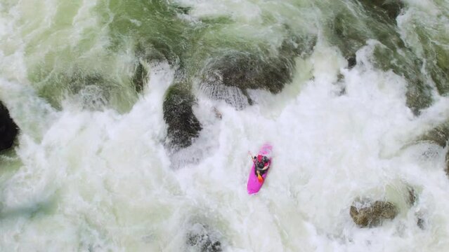 Pink Whitewater Kayak on River Rapids Shot by Drone