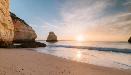 Foto auf Acrylglas Strand Marinha, Algarve, Portugal beautiful sunrise view of a empty beach with rough sand stone rock coastline and nature view praia da marinha famous beach algarve coast in south portugal atlantic ocean