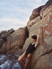 Summertime Sensation: Beautiful Woman in Sexy Swimwear Posing on a Stunning Beach