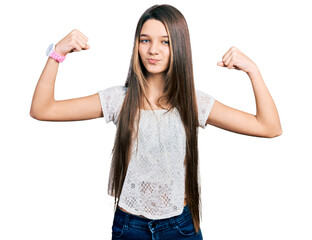 Young brunette girl with long hair wearing white shirt showing arms muscles smiling proud. fitness...